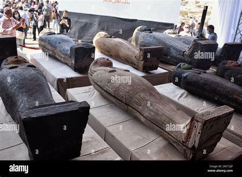 the newly discovered coloured ancient intact and sealed coffins are displayed during a press