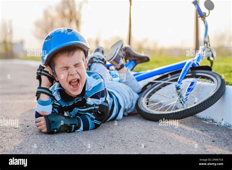 Boy Fell Off Bike Hi Res Stock Photography And Images Alamy
