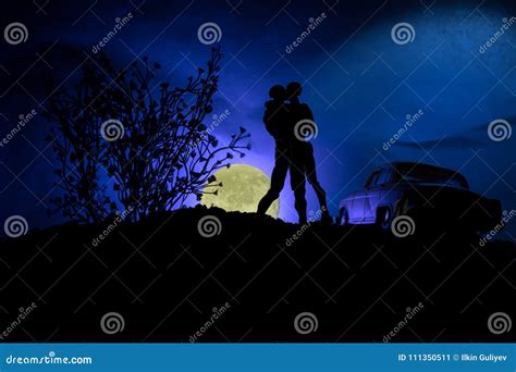 Silhouette Of Couple Kissing Under Full Moon Guy Kiss Girl Hand On