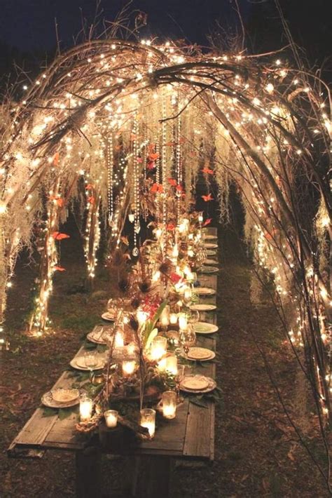 An Enchanted Forest Wedding Reception Under Vine Arches Decorated With