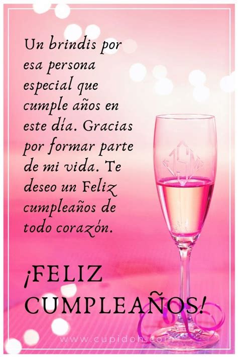 A Glass Of Wine With The Words Feliz Cumpleanos Written In Spanish