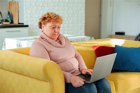 fat old woman with book in hand looking at camera stock image image of female kitchen 237289839