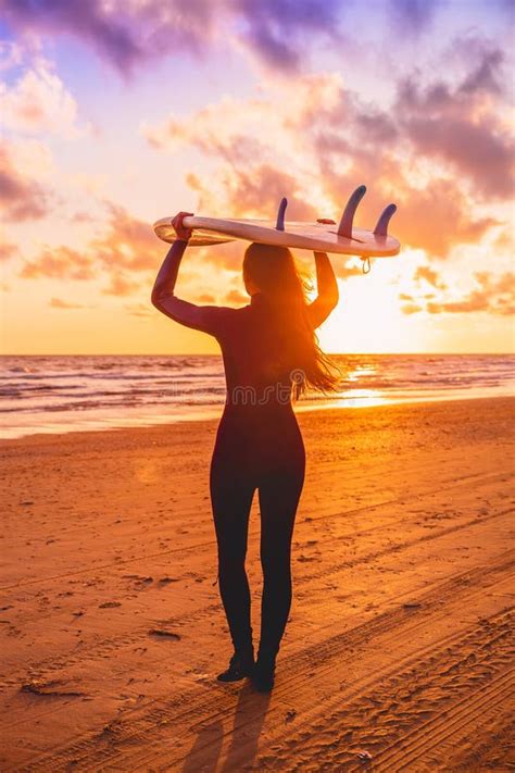 Surf Girl With Long Hair Go To Surfing Woman With Surfboard On A Beach