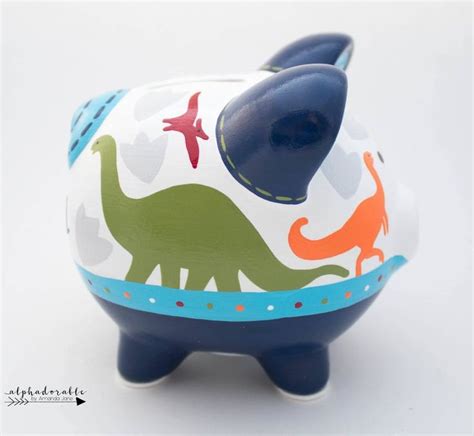 Clear, pink, translucent blue, translucent green, white. Jurassic Dinosaur Personalized Piggy Bank in Navy Blue ...