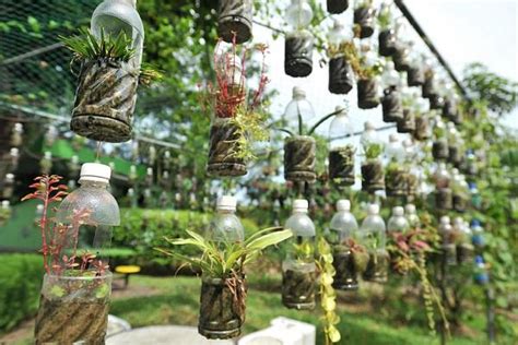Many people have asked how to make sure the bottles do not slip on the rope (or. 13 Plastic Bottle Vertical Garden Ideas | Soda Bottle ...