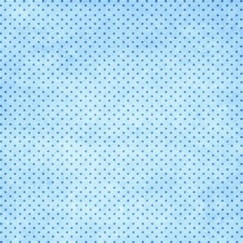 A Blue Background With White Polka Dots