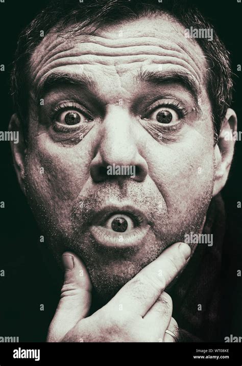 Close Up Portrait Of Man With Artificial Eye In Mouth Stock Photo Alamy