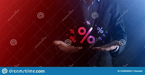 Male Hand Holding Interest Rate Percent Icon On Blue Background
