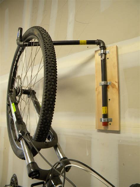 I'm running out of room for stands so im going to need to hang a guitar or two on the wall. Easy DIY Multi Bike Pivoting Wall Rack. www.DIYeasycrafts ...