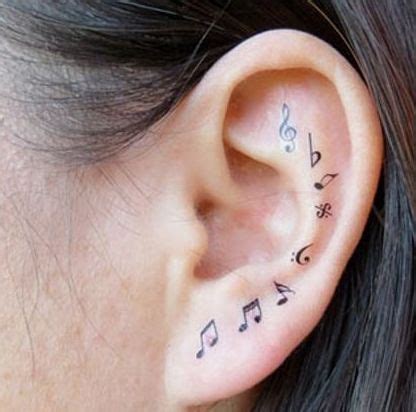 Music tattoos are much more minimalist than others, which may be more elaborate, although some can be mixed with different images. 32 Beautiful Music Note Tattoos -DesignBump