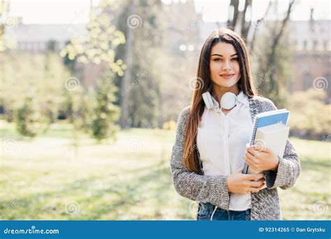 University College Student Girl Looking Happy Smiling With Book Or