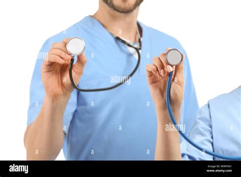 Male And Female Nurses With Stethoscopes On White Background Stock