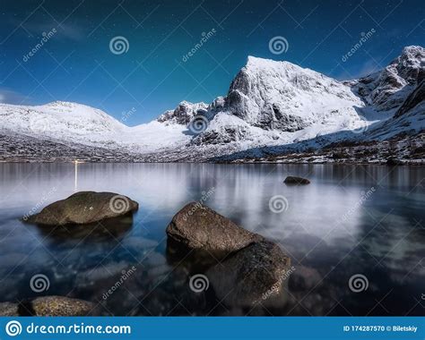 Mountains And Starry Night Sky Lofoten Islands Norway Reflection On