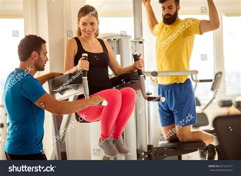 Gymwoman Doing Abdominal Muscles Assisting Her Stock Photo 657222577