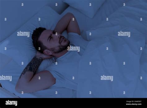 Insomnia And Sleeplessness Concept Depressed Man Unable To Sleep