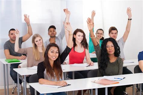 Student Raising Hand In Class