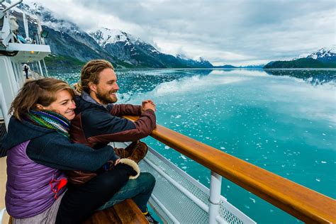 Couple Enjoy The Scenery Of Glacier Bay National Park Grand Pacific Glacier In Background