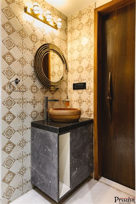 A Bathroom With A Sink Mirror And Tiled Wallpaper In The Shower Stall Area