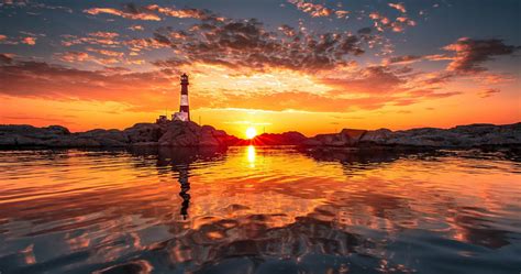 Lighthouse On Beach 4k Ultra Hd Wallpaper Water Sunset Sunset