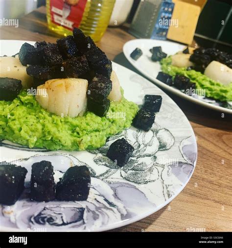 Black Pudding Scallops Pea Purée Stock Photo Alamy