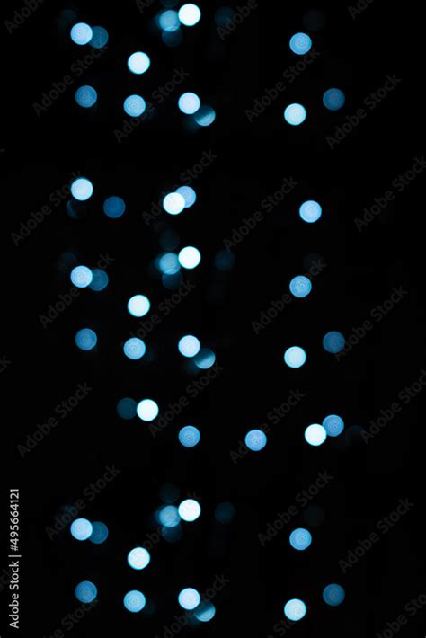 Dark Blurry Background With Blue Bokeh Lights For Textures And
