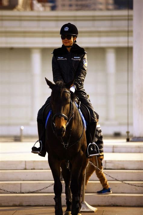 Dalians Mounted Policewoman In Full Leather Uniform