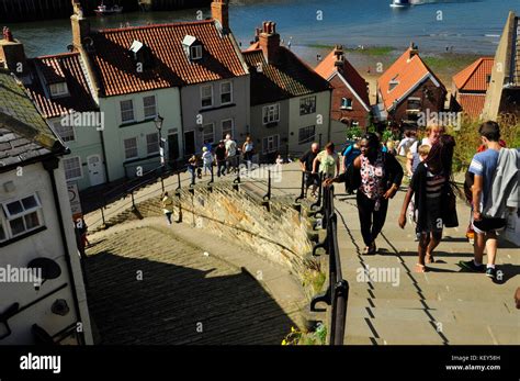 Tourists Climbing The Steep Abbey Steps 199 In Total Leading From The