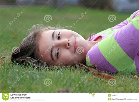 Happy Child Laying In Grass. Stock Image - Image of laying, happy: 35337077