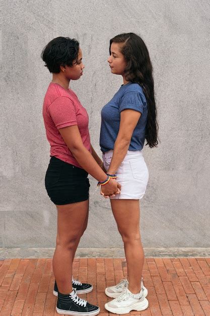 premium photo latina lesbian couple stare at each other during a date in the city