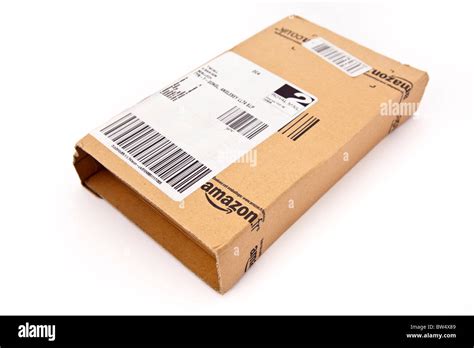 Cardboard package parcel from Amazon isolated on a white background ...