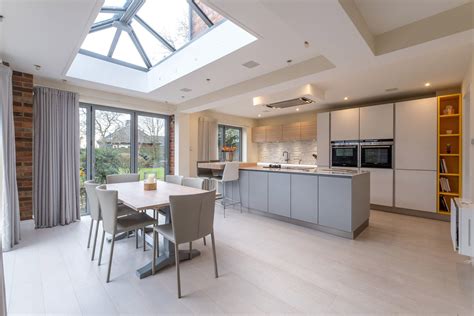 Modern Open Plan Kitchen With Large Island Dinning Table Bifold Doors