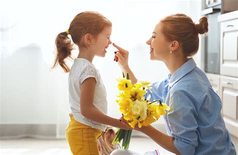 Maybe you would like to learn more about one of these? Happy Mothers Day Child Daughter Gives Mother A Bouquet Of ...