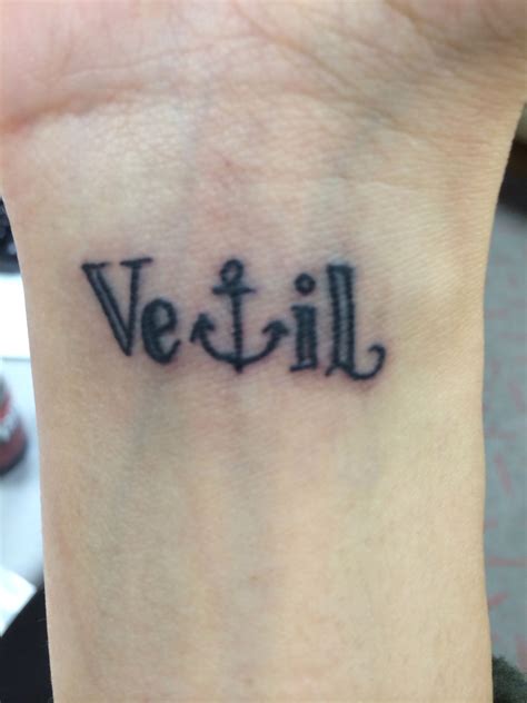 A Small Wrist Tattoo With The Word Vetill On It