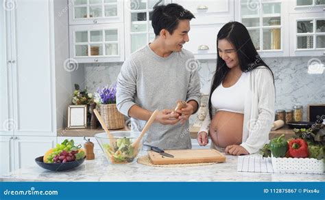 Young Husband Cooking For Pregnant Wife Stock Image Image Of Relationship Making 112875867