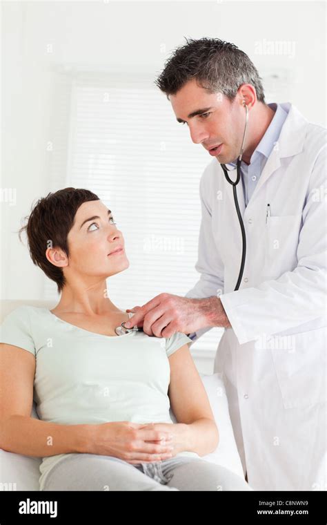Male Doctor Examining A Female Patient Stock Photo Alamy