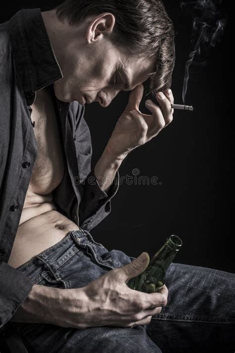 Very Depressed Man Smoking And Drinking Stock Photo Image Of Alone