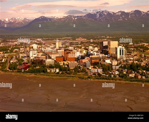 An Aerial View Of Downtown Anchorage And The Chugach Mountains Stock