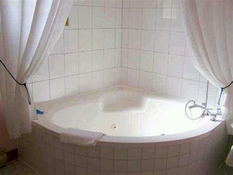 Does anyone know if a curved shower curtain rod would work for a corner shower? Jacuzzi tub and shower curtain | Bathroom fun | Pinterest ...