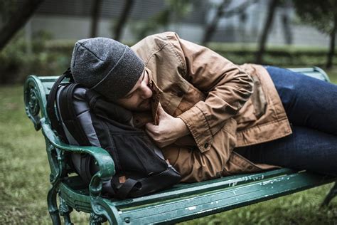 Download Premium Photo Of Homeless People Sleeping On Bench In The Park