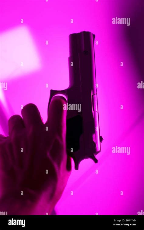 Hand Of Man Holding 9mm Pistol Gun In Crime Thriller Book Cover Design