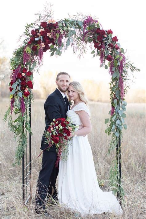 30 Winter Wedding Arches And Altars To Get Inspired 18 Eucalyptus Leaves And Bold Red Flowers