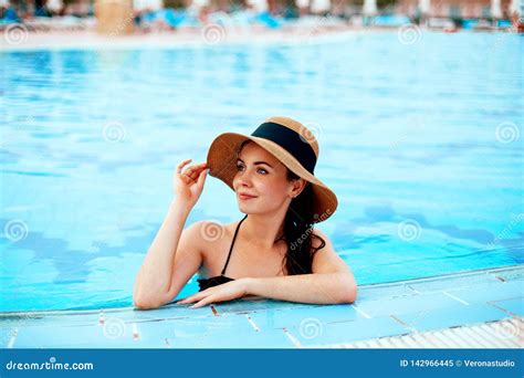 Beautiful Girl With Healthy Skin In Elegant Striped Bikini Sun Hat Relaxing In Swimming Stock