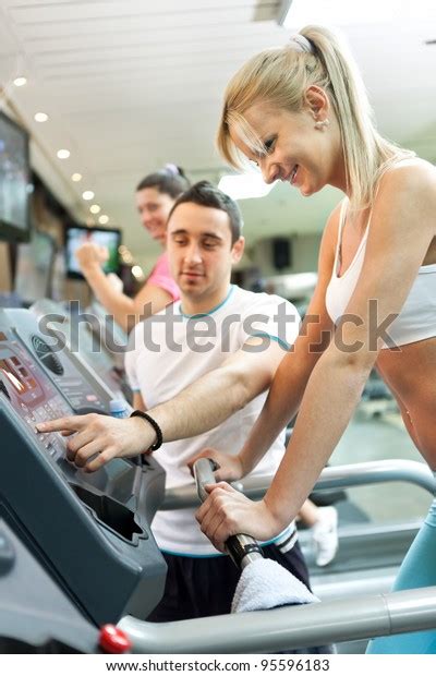 Personal Trainer Instructing Woman How Use Stock Photo 95596183