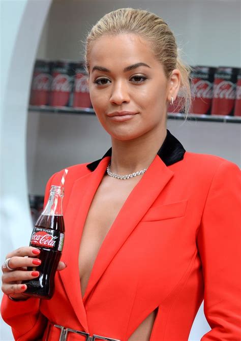 rita ora flashes mega cleavage in plunging red outfit as she celebrates coca cola s launch party