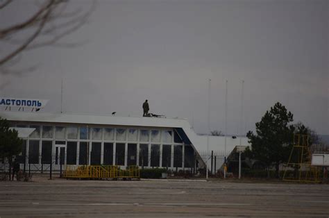 Russian Military Armed Surrounded Air Base And The Airport In