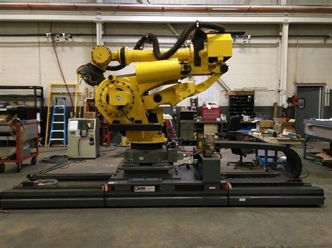 We can integrate fanuc robotic technology with our cartoners, case packers, and other end of line systems. Used FANUC M900iA/600 6 AXIS CNC ROBOT WITH R30iA & 15' 7TH...