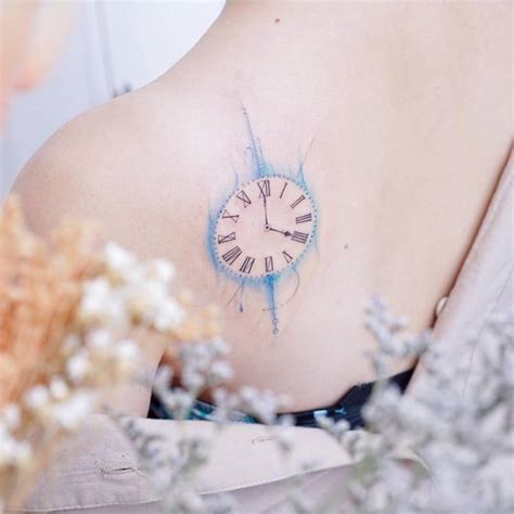 Watercolor Clock Tattoo On The Shoulder Blade