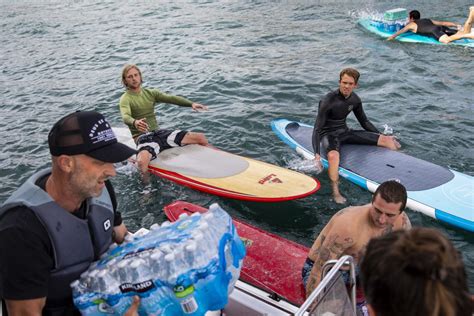 billionaire with yacht surfers and other volunteers help deliver supplies to fire charred