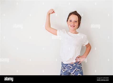 Portrait Of A Girl Flexing Her Muscles Stock Photo Alamy