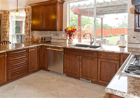 Traditional Kitchen With Dark Cabinets Granite Counter Tops And Tile Floor Countertops